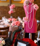 Parisian-Themed Centerpiece
Photography: dMdC Photography
Read More:
http://www.insideweddings.com/weddings/black-white-pink-fashion-themed-bridal-shower/490/ Black framed table name and pink mannequin centerpiece