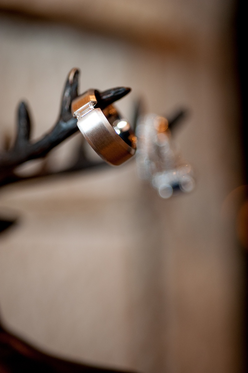 Men's Diamond Band
Photography: Handeland Tesoro Photography
Read More:
http://www.insideweddings.com/weddings/snowy-outdoor-winter-ceremony-cozy-lodge-reception/522/ Baguette diamond in gold tension-set band