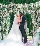 Fairy-Tale Kiss
Photography: Keith + Melissa Photography
Read More:
http://www.insideweddings.com/weddings/magical-fairy-tale-wedding-fit-for-a-princess-at-a-castle-venue/1293/ bride in galia lahav bridal gown kissing groom under lush ceremony arbor, donathan hurley survivor