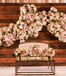 Sweetheart Table in Front of Wood Wall
Photography: Lin %26 Jirsa Photography
Read More:
http://www.insideweddings.com/weddings/destination-multi-day-indian-wedding-with-sunset-inspired-decor/1211/ reclaimed wood wall with flower wall decor sweetheart table settee with white pink flowers