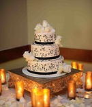 Black Ribbon Cake
Photography: Hazelnut Photography
Read More:
http://www.insideweddings.com/weddings/european-influenced-autumn-wedding-in-los-angeles-california/365/ Porto's Bakery three layer cake with roses