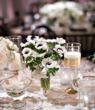White Anemones with Dark Centers
Photography: Laurie Bailey Photography
Read More:
http://www.insideweddings.com/weddings/classic-elegant-country-club-wedding-in-los-angeles-california/1149/ Wedding reception decoration rose in glass bowl gold candlestick white anemone flowers