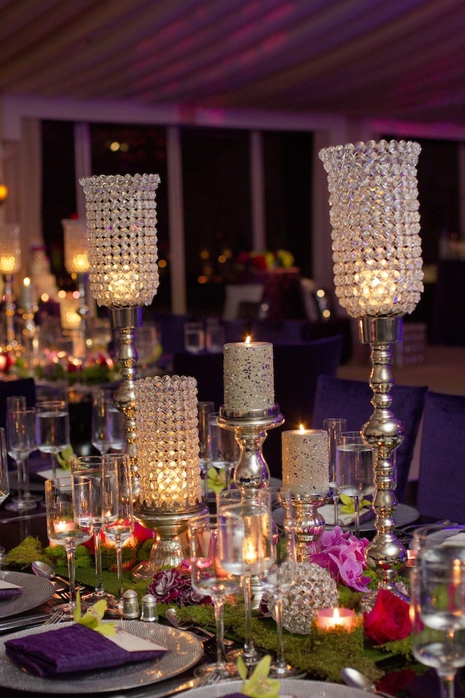 Eclectic Wedding Centerpiece
Photography: Images by Berit, Inc.
Read More:
http://www.insideweddings.com/weddings/contemporary-ballroom-wedding-with-pops-of-purple/408/ Moss centerpiece with crystal bling candleholders and flowers