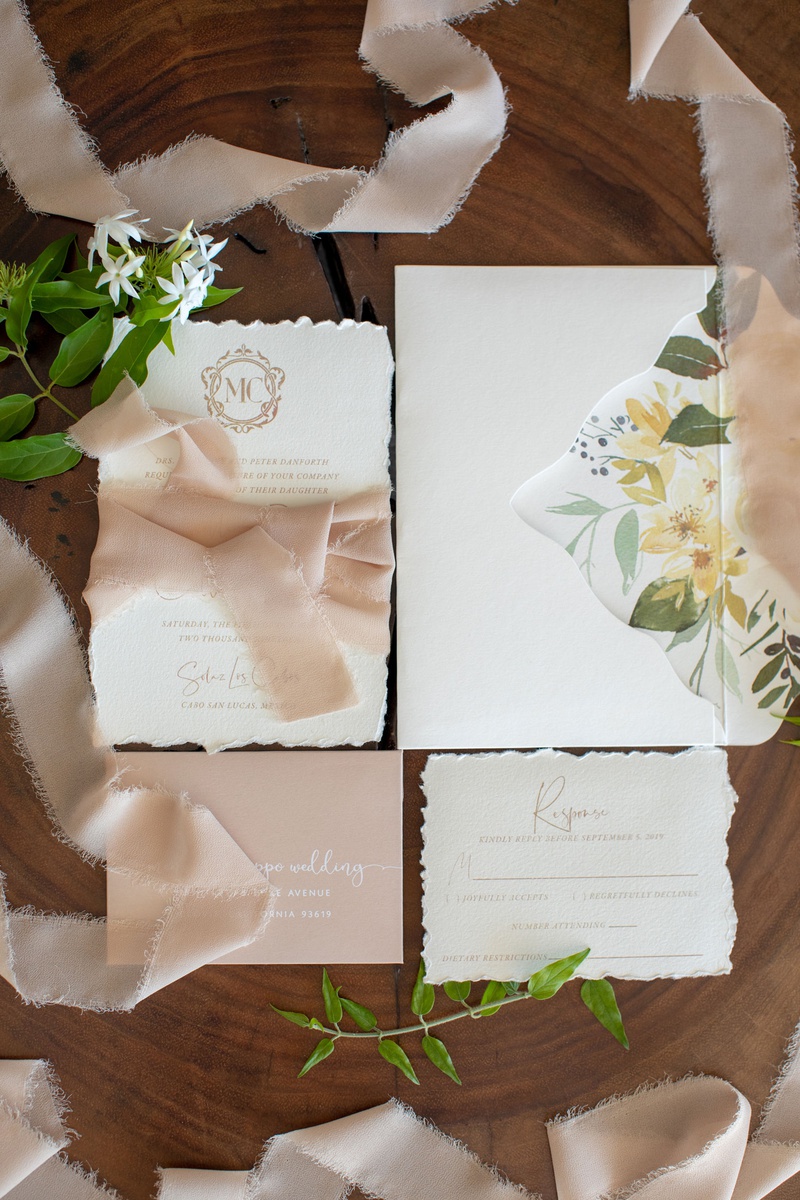 Soft-Hued Invitation Suite
Photography: Collin Pierson Photography
Read More:
http://www.insideweddings.com/weddings/beach-wedding-ceremony-romantic-reception-inspiration-in-cabo/1304/ torn edge stationery flower print envelope liner ribbon blush monogram frayed edge