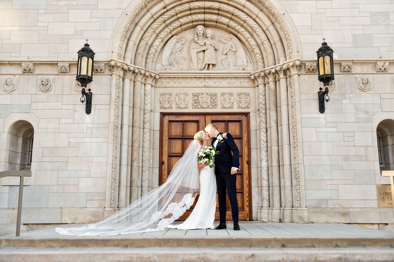 Couple's Portrait in Front of Church
Photography: Laurie Bailey Photography
Read More:
http://www.insideweddings.com/weddings/traditional-wedding-at-same-venues-as-the-brides-parents-nuptials/1364/ wedding portrait bride and groom kiss in front of church doors catholic church wedding