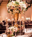 Taper Candles %26 Tall Centerpiece on Table
Photography: Lin %26 Jirsa Photography
Read More:
http://www.insideweddings.com/weddings/destination-multi-day-indian-wedding-with-sunset-inspired-decor/1211/ wedding reception flower chandelier greenery tall gold centerpiece white pink flowers taper candles