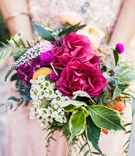 Rustic Bridesmaid Bouquet
Photography: Amanda McKinnon Photography
Read More:
http://www.insideweddings.com/weddings/bride-wears-claire-pettibone-gown-to-bohemian-outdoor-wedding/668/ Red, white, yellow, fuchsia flowers with greenery in a bridesmaid bouquet with a rustic feel