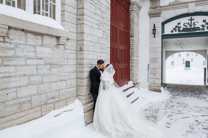 Bride %26 Groom Kiss in Quebec City
Photography: Joel %26 Justyna
Read More:
http://www.insideweddings.com/weddings/dreamy-winter-destination-wedding-in-an-ice-castle-in-quebec-city/1270/ wedding portrait bride and groom outside winter wedding quebec city canada stone building tall doors