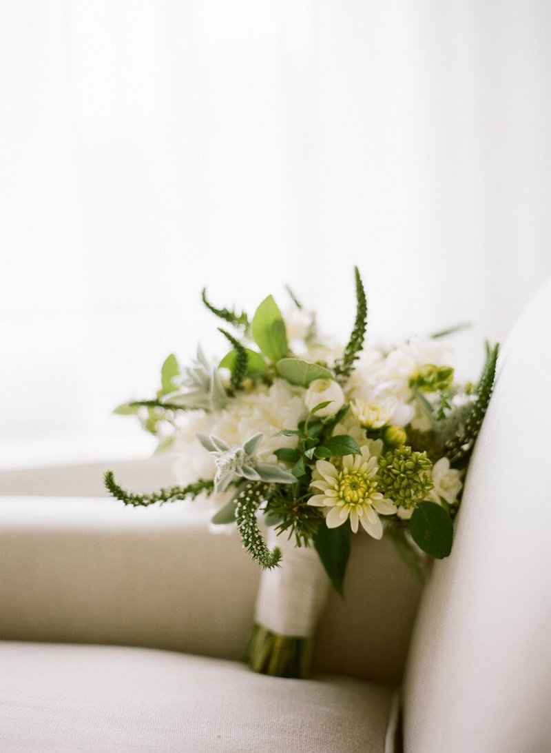 Verdant Bridal Bouquet with White Wrap
Photography: Eric Kelley
Read More:
http://www.insideweddings.com/weddings/summer-wedding-with-clean-color-palette-modern-design-in-chicago/776/ green and white bridal bouquet wrapped with satin white ribbon on armchair