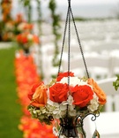 Red and Orange Aisle Marker
Photography: TripleCord Photography
Read More:
http://www.insideweddings.com/weddings/beachside-summer-wedding-at-the-montage-laguna-beach/287/ Glass vessel filled with roses and hydrangeas