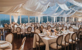 Tented Reception with Drapery %26 Lights
Photography: Joel %26 Justyna
Read More:
http://www.insideweddings.com/weddings/french-inspired-tented-wedding-at-the-brides-family-vacation-home/1195/ tent wedding with french oval chairs drapery patio lights low centerpieces