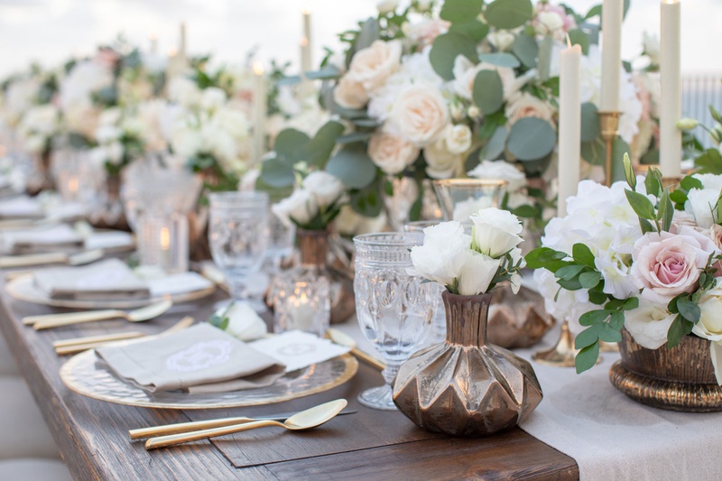 Textured Vases %26 Cut-Crystal Glassware
Photography: Collin Pierson Photography
Read More:
http://www.insideweddings.com/weddings/beach-wedding-ceremony-romantic-reception-inspiration-in-cabo/1304/ wedding reception table wood with dark metallic bronze vase antique glassware white flowers gold