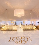 Monogram Dance Floor
Photography: Amanda Sudimack for Artisan Events
Read More:
http://www.insideweddings.com/weddings/a-fairy-tale-wedding-fit-for-former-miss-illinois/569/ Tent wedding with gold monogram on white dance floor