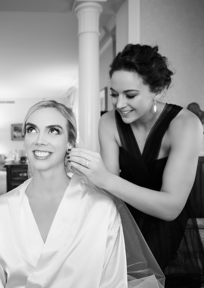 Black and White Photo of Matron of Honor Helping with Earrings
Photography: Carasco Photography
Read More:
http://www.insideweddings.com/weddings/new-york-yankees-infielder-marries-in-opulent-chicago-soiree/764/ maid of honor helps bride with earrings