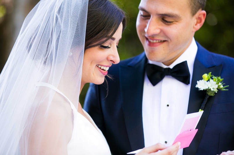 Bride Reads Letter in Front of Groom
Photography: Callaway Gable
Read More:
http://www.insideweddings.com/weddings/alfresco-summer-wedding-with-lush-foliage-accents-in-california/805/ bride opens pink letter and reads it in front of her groom before their ceremony