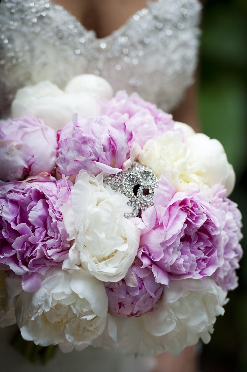 Bride's Bouquet of Peonies %26 Brooch
Photography: Images by Berit, Inc.
Read More:
http://www.insideweddings.com/weddings/wedding-with-purple-modern-details-at-a-chateau-in-new-jersey/693/ Wedding bouquet of white and light pink peonies, rhinestone brooch