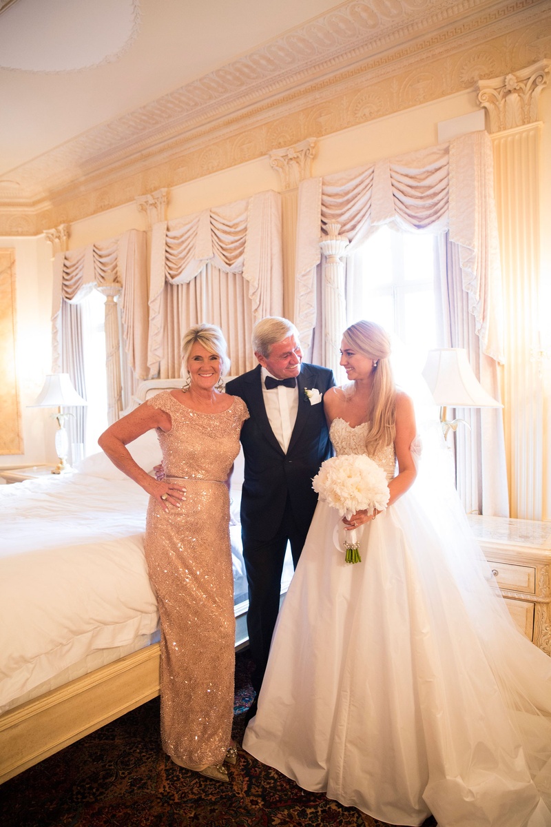 Mother %26 Father in Bridal Suite with Bride
Photography: Nancy Cohn Photography
Read More:
http://www.insideweddings.com/weddings/destination-wedding-with-white-gold-color-palette-in-palm-beach/1028/ Bride in strapless Reem Acra wedding dress with bouquet in bridal suite with mom in sparkly dress