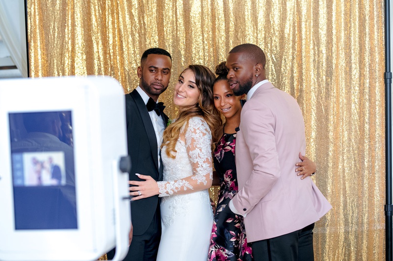 Fun in the Photo Booth
Photography: Kesha Lambert Photography
Read More:
http://www.insideweddings.com/weddings/personalized-ceremony-with-pink-florals-at-a-loft-in-new-york-city/1210/ bride and groom taking pictures in front of a shimmering gold curtain photo booth