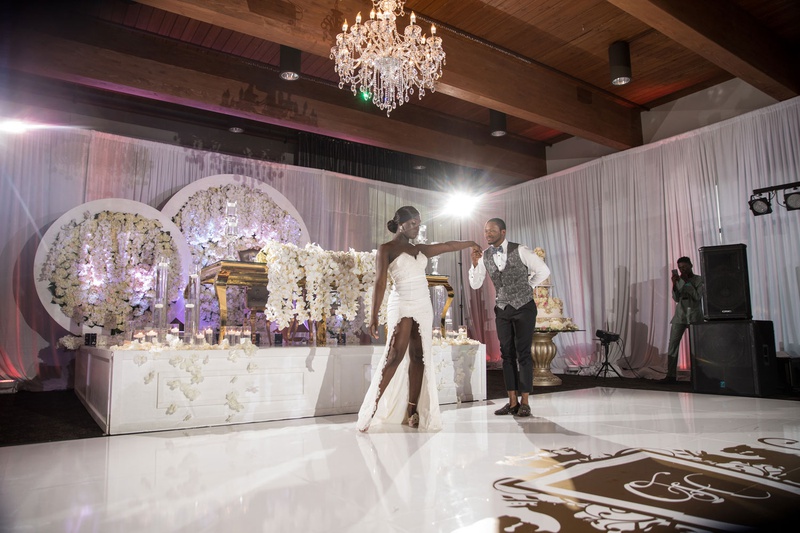 Bride in Second Dress for First Dance
Photography: Brian Bossany Photography
Read More:
http://www.insideweddings.com/weddings/luxurious-heaven-inspired-royal-wedding-celebration-in-minneapolis/1333/ wedding reception bride in high slit dress groom in vest dance floor in front of sweetheart table