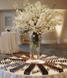 Black Escort Cards %26 White Arrangement
Photography: James Moes
Read More:
http://www.insideweddings.com/weddings/outdoor-fall-ceremony-luxe-ballroom-reception-in-beverly-hills/1214/ wedding reception white stock in glass vase black escort cards white tablecloth
