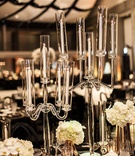 Glass Candelabra
Photography: Kristina Lee Photography
Read More:
http://www.insideweddings.com/weddings/black-and-white-wedding-with-modern-mixed-metals-in-los-angeles/1009/ glass candelabra with tapered candles as part of wedding reception decor