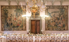 Tapestries at Italian Reception
Photography: Bottega53
Read More:
http://www.insideweddings.com/weddings/destination-wedding-at-a-tuscan-style-villa-in-florence-italy/1181/ wedding reception long table wood vineyard chairs tapestry hanging on wall wood door villa venue