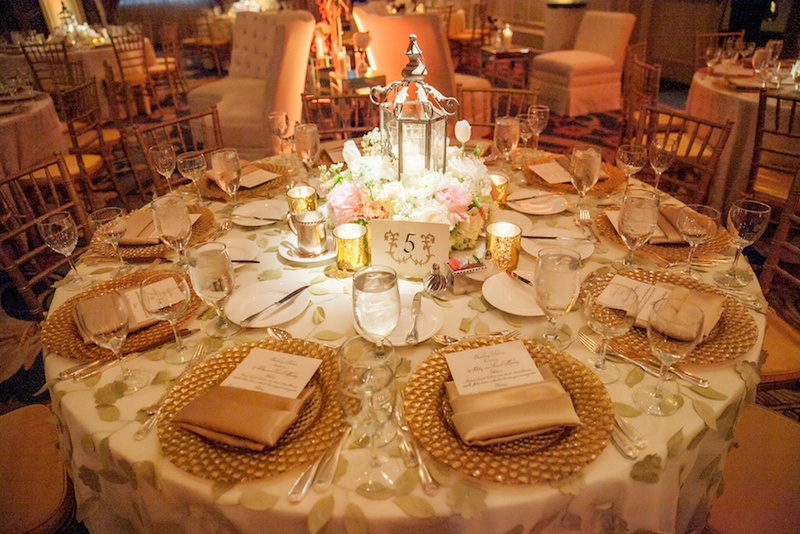 Fabric Leaf Tablecloth
Photography: Michael Carr Photography
Read More:
http://www.insideweddings.com/weddings/traditional-church-ceremony-forest-inspired-reception-in-houston/695/ Round reception table with leaf linen and gold charger plates