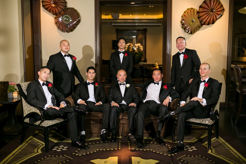 Groom In Giorgio Armani Tuxedo White Rose Boutonniere Groomsmen With Red Boutonnieres Groom In Giorgio Armani Tuxedo White Rose Boutonniere Groomsmen With Red Boutonnieres