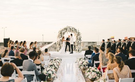 Outdoor Colombian Ceremony
Photography: Elizabeth Fogarty
Read More:
http://www.insideweddings.com/weddings/destination-wedding-with-lush-garden-inspired-details-in-colombia/1215/ wedding ceremony flower wall white shiny aisle runner low flowers in gold urns colombia outdoor