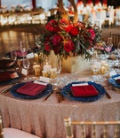 Round Table with Rose Gold Linens
Photography: Jennifer Martin Photography
Read More:
http://www.insideweddings.com/weddings/a-pro-tennis-players-fall-wedding-featuring-a-moody-color-palette/997/ rose gold sequin linen, navy charger plate, burgundy napkins