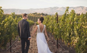 Couple in Central Coast Vineyard
Photography: Matt Kennedy Photography
Read More:
http://www.insideweddings.com/weddings/alfresco-ceremony-rustic-chic-barn-reception-in-san-luis-obispo/881/ Groom in suit and bride in low v-back Mira Zwillinger wedding dress from Carine's Bridal Atelier