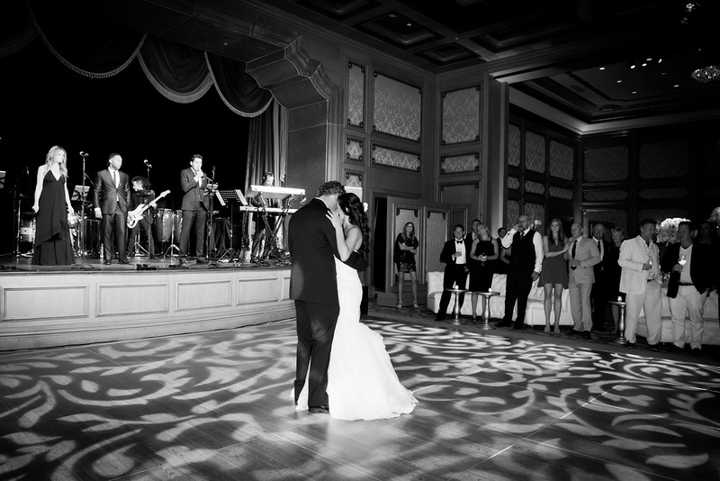 First Dance on Grand Del Mar Dance Floor
Photography: Boyd Harris Photographs
Read More:
http://www.insideweddings.com/weddings/a-jeweled-floral-wedding-at-fairmont-grand-del-mar-in-san-diego/745/ Black and white photo of bride and groom sharing their first dance on gobo projection dance floor