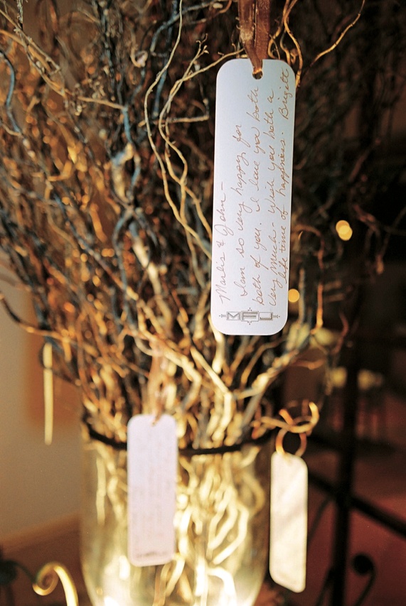 Wishing Tree Guestbook
Photography: Nino Rakichevich Photography
Read More:
http://www.insideweddings.com/weddings/wedding-with-cinderella-theme-in-santa-barbara-california/61/ Rectangular cards tied with golden ribbon on branches