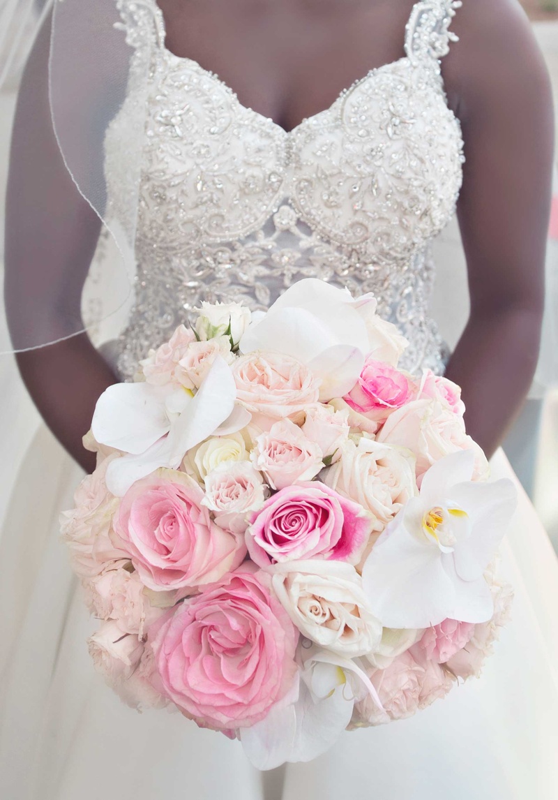 Bouquet with White Orchids %26 Pink Roses
Photography: Carasco Photography
Read More:
http://www.insideweddings.com/weddings/church-ceremony-with-nigerian-traditions-chic-ballroom-reception/845/ Bride in jewel bodice wedding dress holding pink rose white orchid bridal bouquet