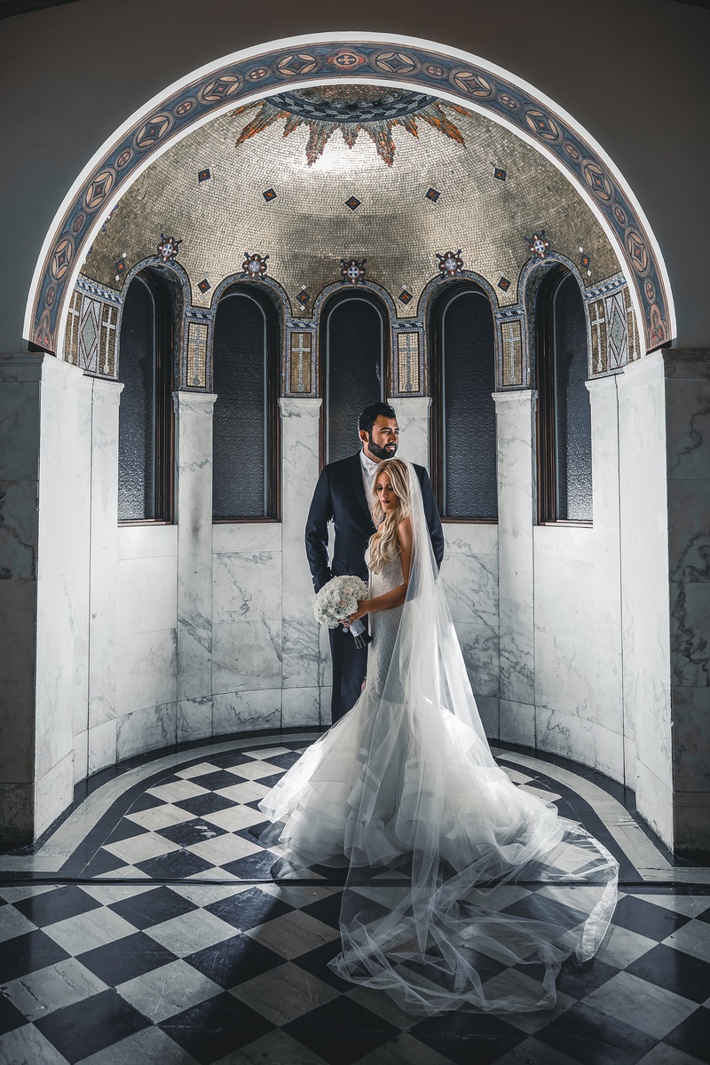 Dramatic Couple's Portrait at Vibiana
Photography: Jimmy Bui Photography
Read More:
http://www.insideweddings.com/weddings/elegant-edgy-wedding-inspired-by-disney-at-vibiana-in-downtown-la/1229/ wedding portrait bride in mermaid wedding dress white bouquet groom in suit and white bow tie
