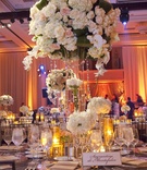 Table Décor
Photography: Simone %26 Martin Photography
Read More:
http://www.insideweddings.com/weddings/soft-romantic-fall-winery-wedding-in-santa-barbara-california/344/ Wedding reception table with light tall and low floral arrangements and candles