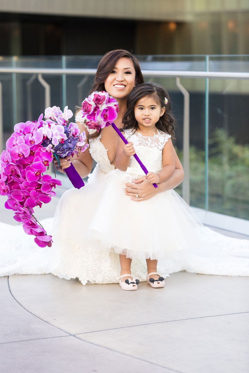 Bride and Flower Girl with Florals
Photography: Brian Leahy Photography
Read More:
http://www.insideweddings.com/weddings/a-hawaiian-couples-luxurious-destination-wedding-in-las-vegas/1226/ adorable flower girl with minnie mouse, fuchsia orchid pomander flower wand