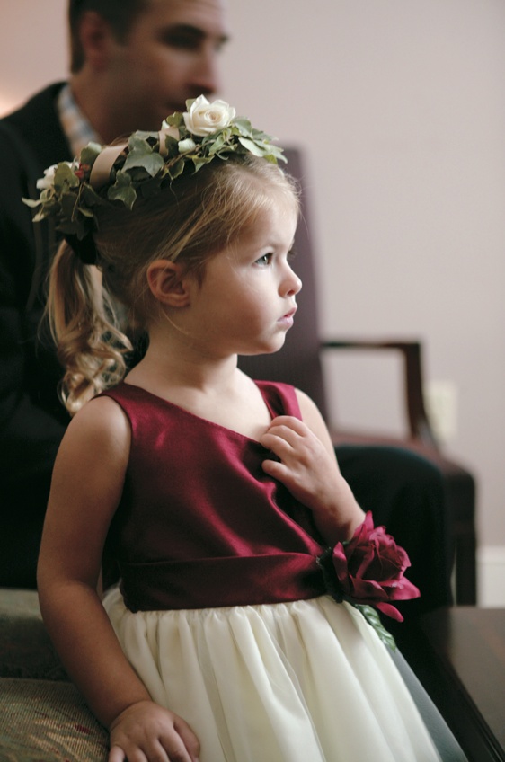 Red and Ivory Flower Girl Dress
Photography: Mark Staff Photography
Read More:
http://www.insideweddings.com/weddings/autumn-inspired-golf-club-wedding-in-south-carolina/149/ Flower girl with green and white flower crown and burgundy dress