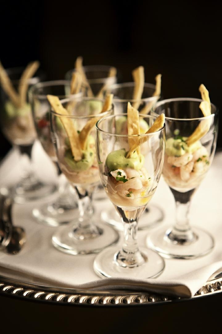 Shrimp Ceviche in Glass
Photography: Catherine Hall Studios
Read More:
http://www.insideweddings.com/weddings/metropolitan-san-francisco-wedding-at-luxury-hotel/411/ Drinking glass filled with guacamole, fish, and chips