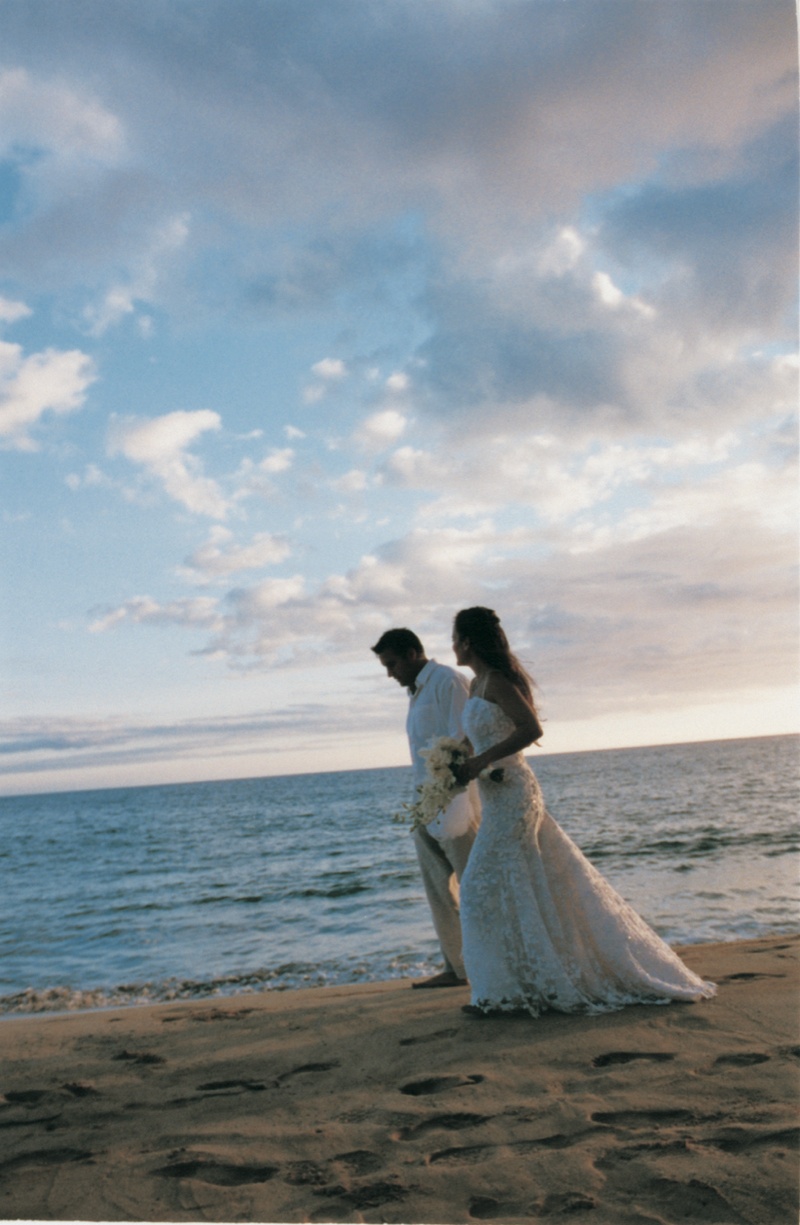 Bride and Groom Walk on Beach
Photography: David Michael Photography
Read More:
http://www.insideweddings.com/weddings/tropical-seaside-wedding-in-lanai-hawaii/60/ bride and groom walk across the sand next to the ocean