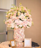 Pastel Floral Arrangement in Fresh Rose Vase
Photography: Chip Gillespie
Read More:
http://www.insideweddings.com/weddings/classic-jewish-wedding-at-a-synagogue-in-houston-texas/718/ Welcome table at a Jewish wedding ceremony with vase covered in pale purple, orange, white roses