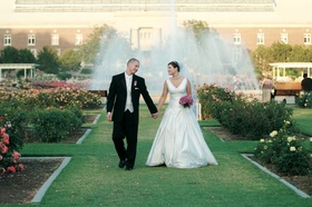 Newlyweds in Rose Garden
Photography: Jim Kennedy Photographers
Read More:
http://www.insideweddings.com/weddings/spring-wedding-at-the-natural-history-museum-of-los-angeles-county/82/ Bride and groom walk through garden with large fountain