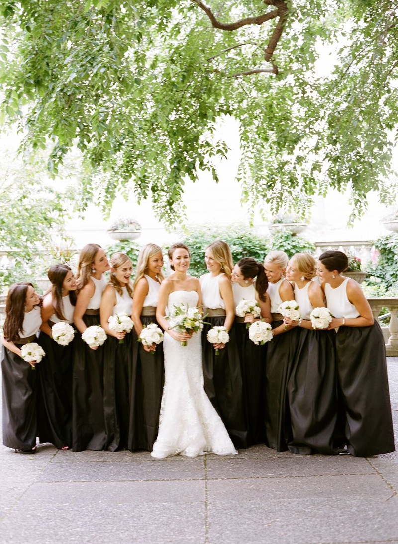 Bride with Bridesmaids in Skirts and Tops
Photography: Eric Kelley
Read More:
http://www.insideweddings.com/weddings/summer-wedding-with-clean-color-palette-modern-design-in-chicago/776/ bride in vera wang gown, bridesmaids in long black skirts, white silk tops, leather belts