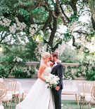 Shelby Beard %26 Jake Parrish
Photography: Jacqui Cole Photography
Read More:
http://www.insideweddings.com/weddings/timeless-luxury-wedding-with-personalized-details-in-austin-texas/1377/ bride in strapless a line wedding dress groom in tuxedo tree with white flowers gold chairs guests