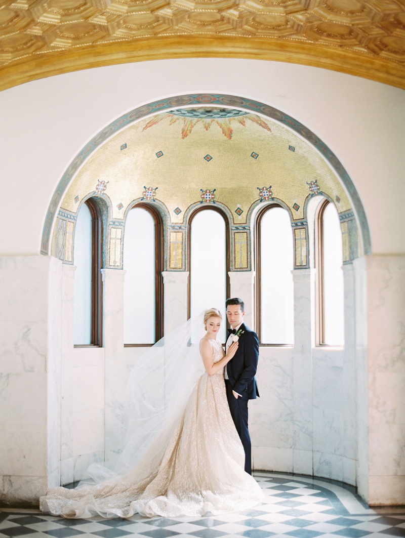 Bride %26 Groom in Archway at Vibiana
Photography: Mallory Dawn Photography
Read More:
http://www.insideweddings.com/weddings/outdoor-jewish-ceremony-luxe-reception-at-vibiana-in-downtown-la/1259/ bride and groom portrait downtown los angeles venue vibiana mosaic arch checkerboard floor lazaro
