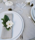 Place Setting
Photography: Jose Villa Photography
Read More:
http://www.insideweddings.com/weddings/california-oceanside-wedding-with-natural-elements/286/ Wedding reception place setting with flax napkin and herbs and gardenia