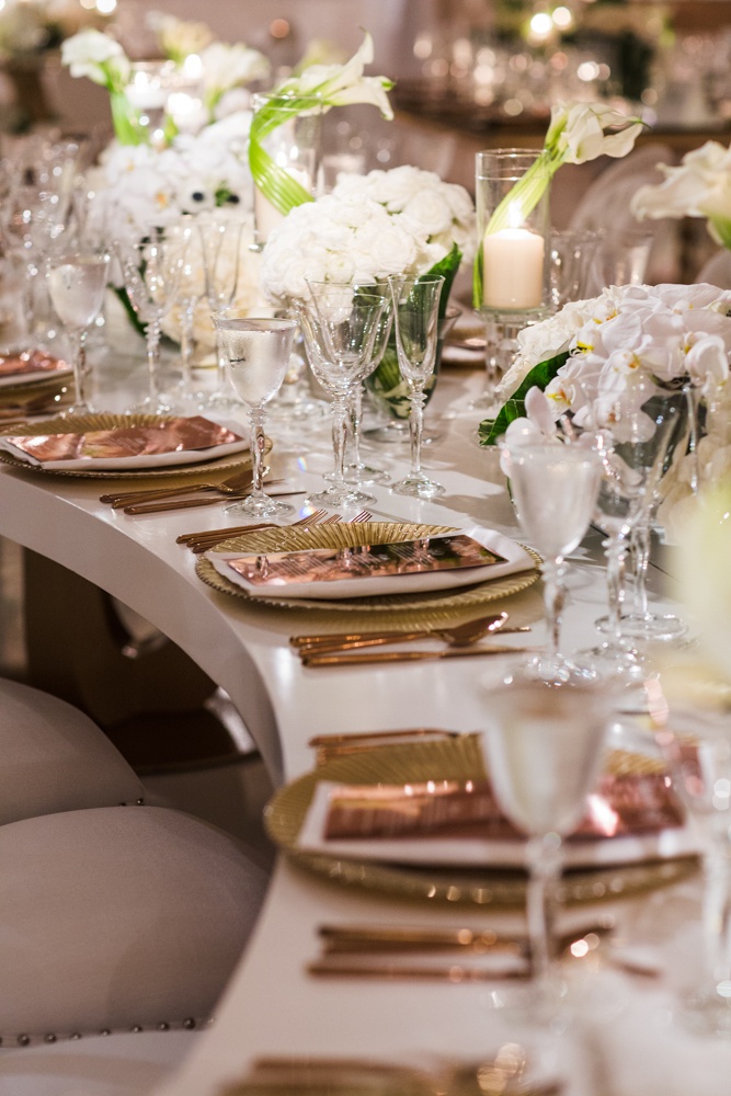 Serpentine Table with Mixed Metals
Photography: Samuel Lippke Studios
Read More:
http://www.insideweddings.com/weddings/outdoor-jewish-wedding-ceremony-luxe-reception-in-california/1160/ Wedding reception white serpentine s table gold charger rose gold copper flatware and menu white
