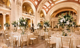 Elegant Reception Marble Hall
Photography: Karlisch Photography
Read More:
http://www.insideweddings.com/weddings/traditional-mass-classic-wedding-reception-on-new-years-eve/1261/ wedding reception marble hall arches columns high ceilings gold chairs tall centerpiece greenery