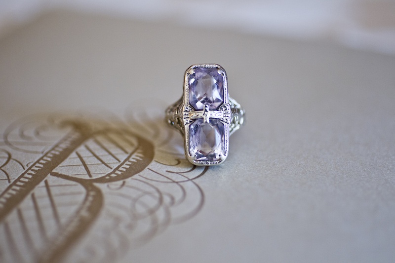 Amethyst Pinkie Ring
Photography: Images by Berit, Inc.
Read More:
http://www.insideweddings.com/weddings/wedding-with-purple-modern-details-at-a-chateau-in-new-jersey/693/ Bride's two-stone, emerald-cut amethyst ring