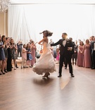 Groom Twirls Bride on Dance Floor
Photography: Carasco Photography
Read More:
http://www.insideweddings.com/weddings/jewish-wedding-with-classic-ivory-and-gold-decor-in-chicago/983/ bride in essence of australia wedding dress, groom in bonobos tux, twirl on dance floor
